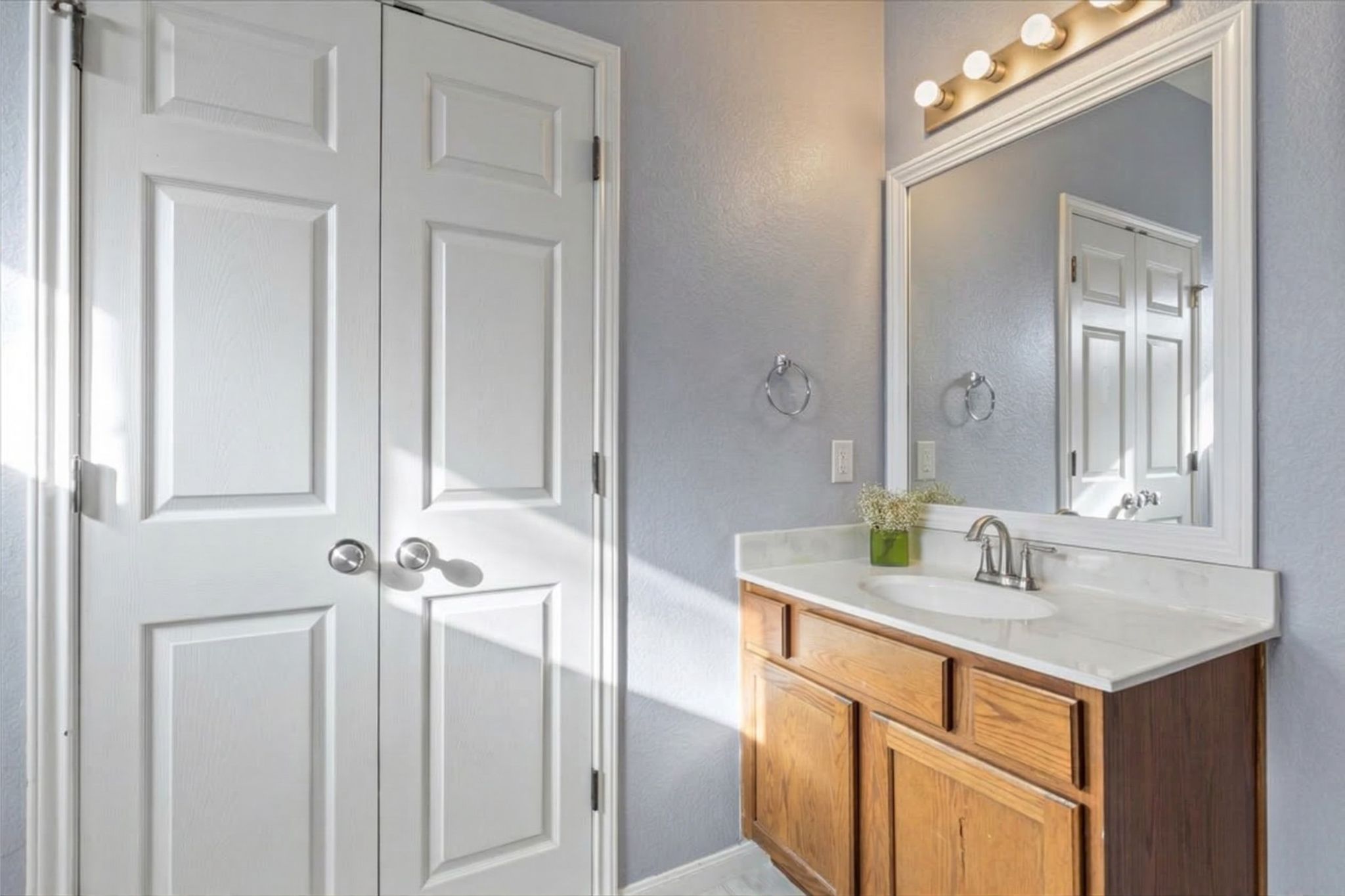 3523 Cheyenne Street Round Rock, TX 78665 - Photo 15 of 34 Bathroom featuring vanity and a textured wall