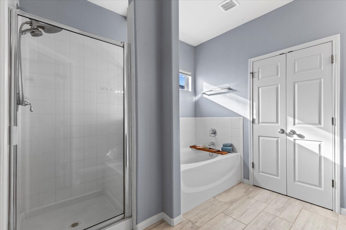 3523 Cheyenne Street Round Rock, TX 78665 - Photo 16 of 34 Full bathroom featuring a garden tub and a stall shower