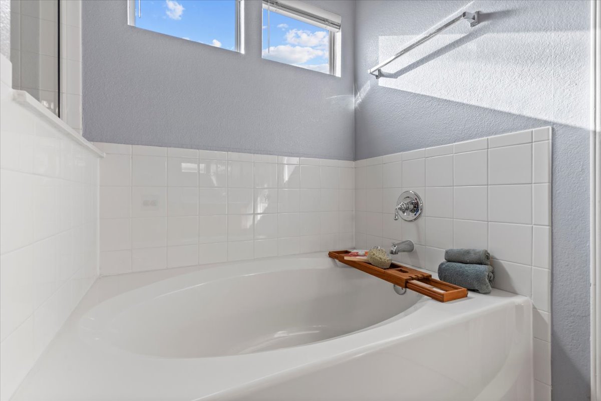 3523 Cheyenne Street Round Rock, TX 78665 - Photo 17 of 34 Full bath with a bath and a textured wall