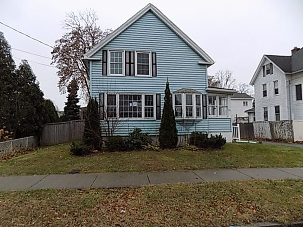56 Fairview Avenue Chicopee, MA 01013 - Photo 1 of 22 a view of a house with a yard in the background