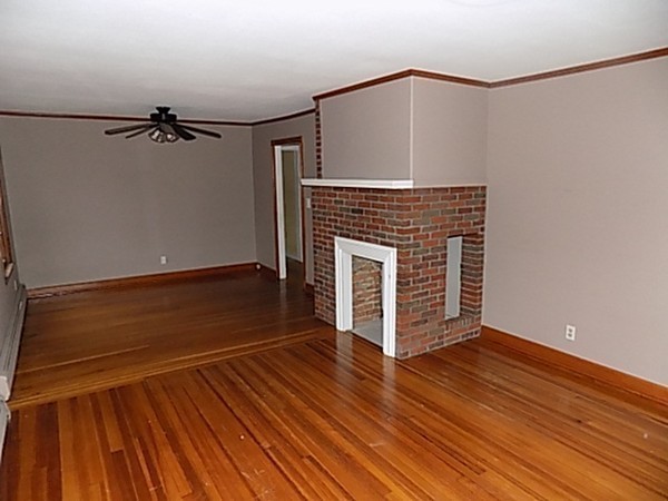 56 Fairview Avenue Chicopee, MA 01013 - Photo 12 of 22 a view of empty room with wooden floor and fan