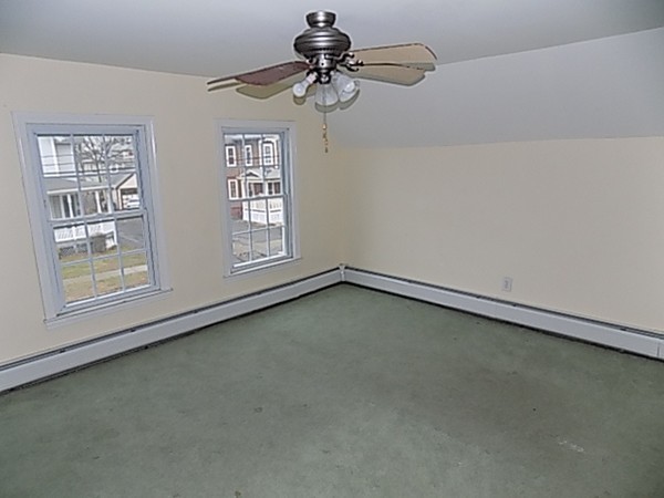 56 Fairview Avenue Chicopee, MA 01013 - Photo 13 of 22 a view of a livingroom with a ceiling fan and window