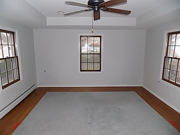 56 Fairview Avenue Chicopee, MA 01013 - Photo 22 of 22 an empty room with windows and fan