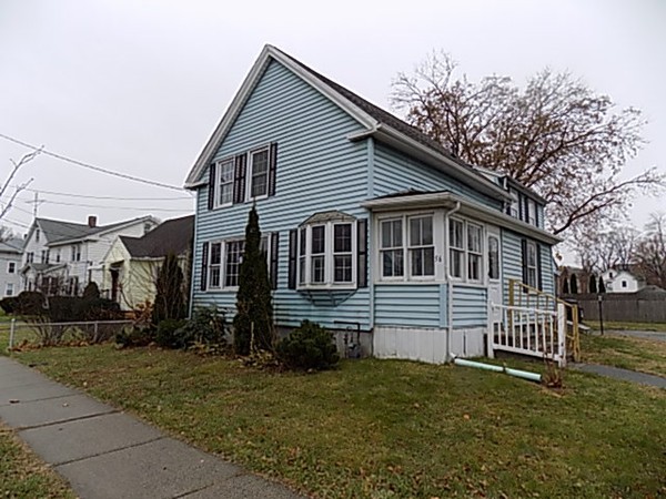 56 Fairview Avenue Chicopee, MA 01013 - Photo 3 of 22 a front view of a house with a yard
