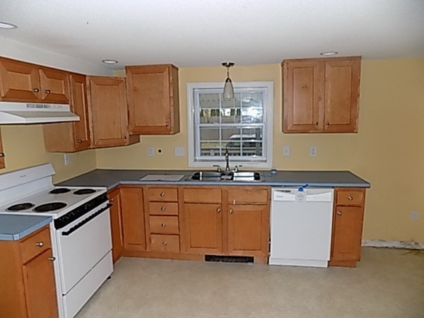 56 Fairview Avenue Chicopee, MA 01013 - Photo 9 of 22 a kitchen with granite countertop cabinets stainless steel appliances and a sink