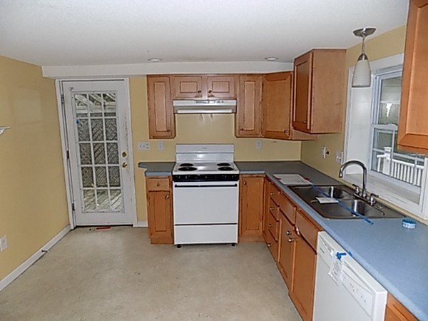 56 Fairview Avenue Chicopee, MA 01013 - Photo 10 of 22 a kitchen with stainless steel appliances granite countertop a stove and a sink