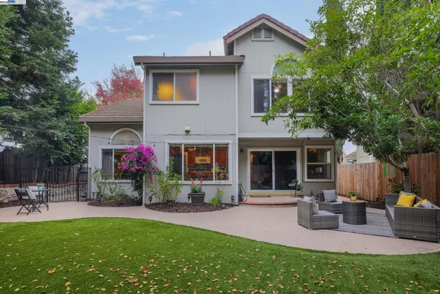 a front view of house with yard and outdoor seating