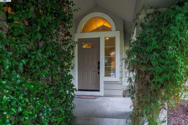 front view of a house with a garden