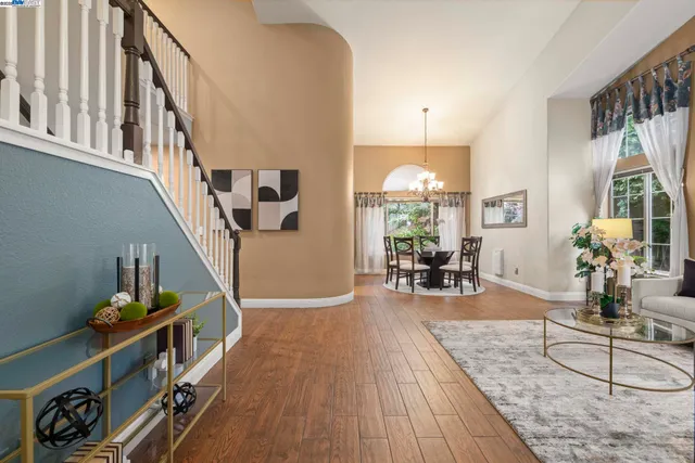a view of a livingroom with furniture and hardwood floor