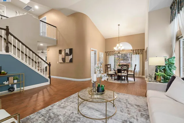 a living room with furniture and white walls
