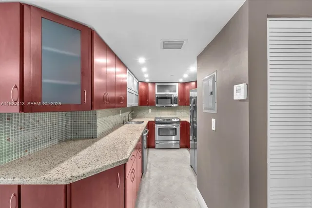 a living room with furniture and a pool table