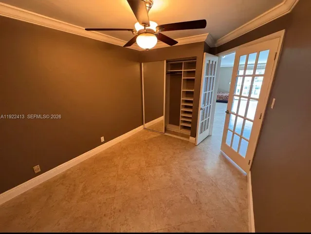 a spacious bedroom with a bed and a table