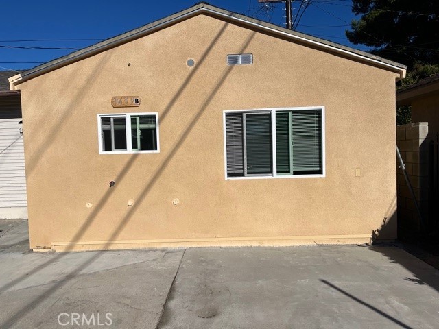 9659 Woodruff Avenue, Unit B Temple City, CA 91780 - Photo 1 of 8 a front view of a house with a yard