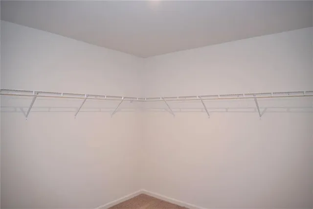 a bathroom with a sink vanity and a toilet