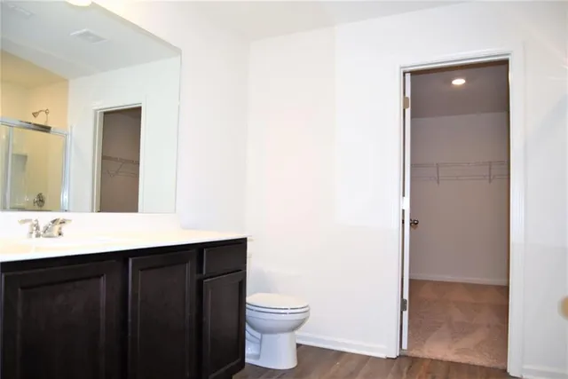 a bathroom with a glass shower door
