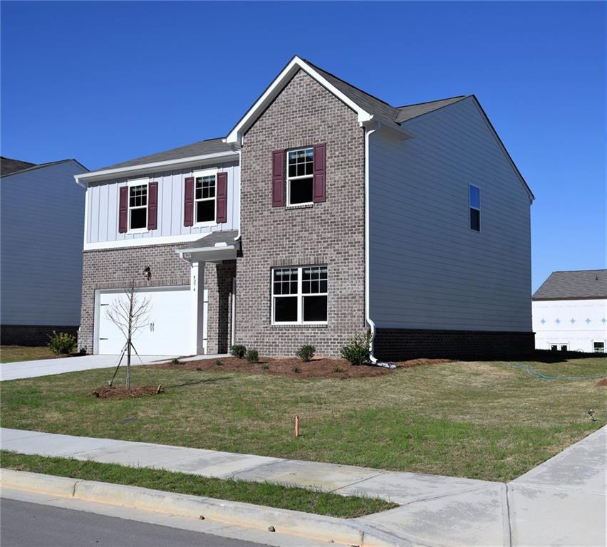 4374 Kendrick Circle Loganville, GA 30052 - Photo 3 of 25 a house view with a garden