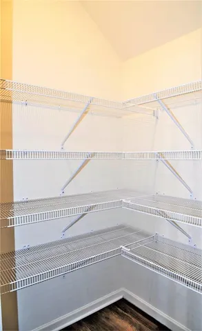 a view of kitchen with microwave oven stove and oven