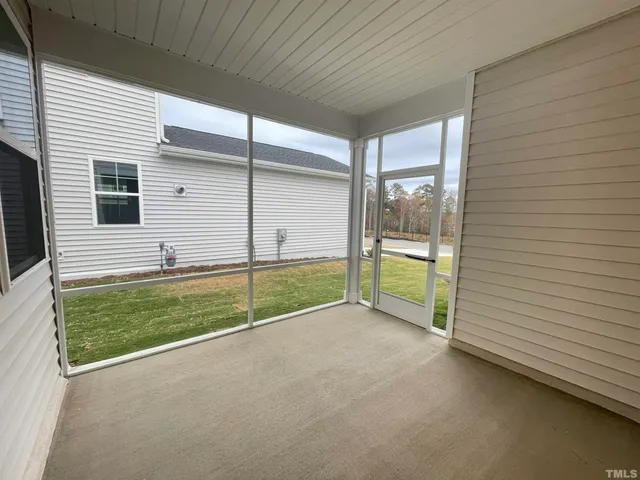 a view of a house with a yard and garage