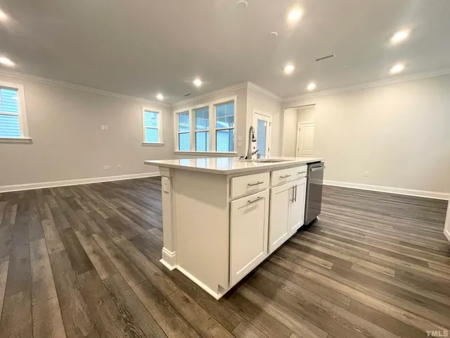 a kitchen with stainless steel appliances granite countertop a stove and a sink