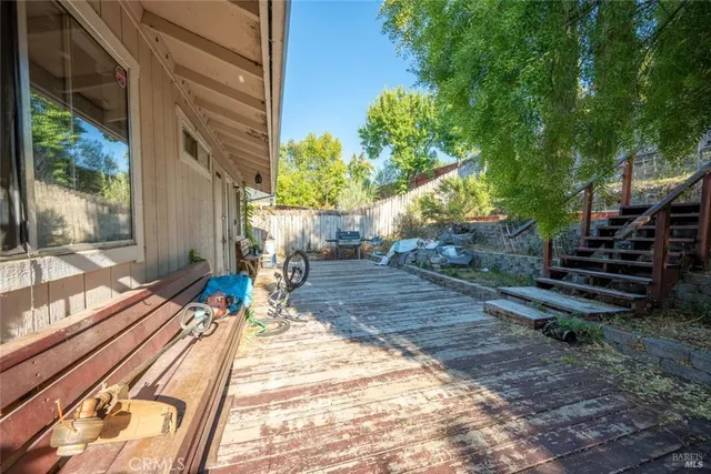 a view of a backyard with sitting area