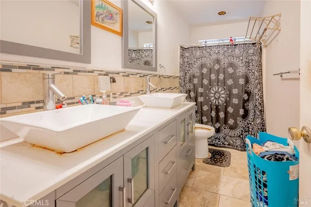a bathroom with a sink vanity granite and a sink