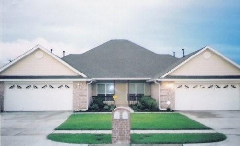 1262 Trailwood Drive Hurst, TX 76053 - Photo 1 of 1 a front view of a house with a yard and garage