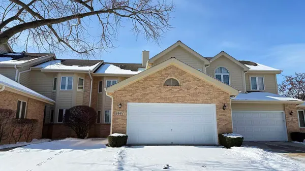 a front view of a house with parking