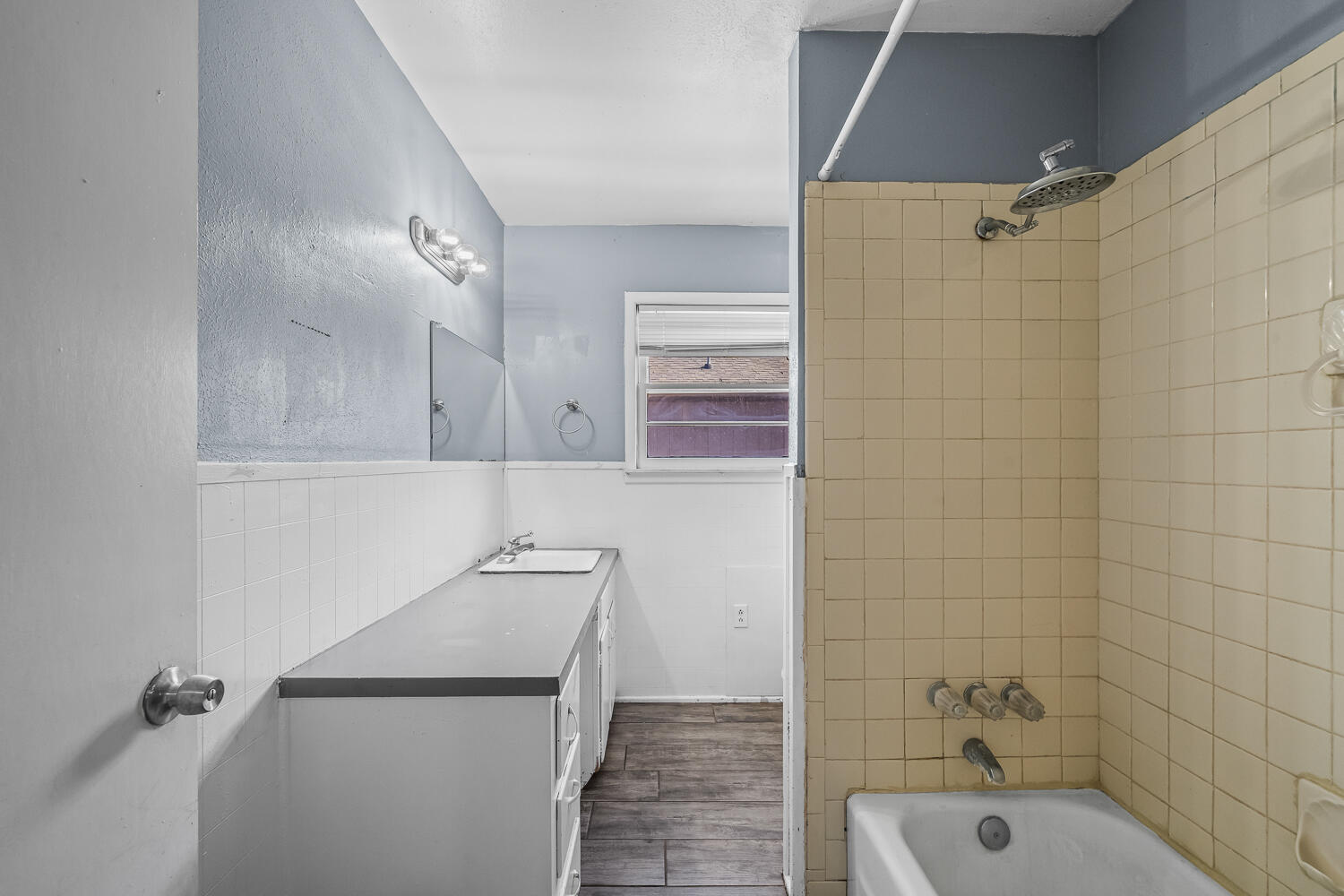 3409 East 17th Street Lubbock, TX 79403 - Photo 12 of 24 a bathroom with a sink a toilet and shower