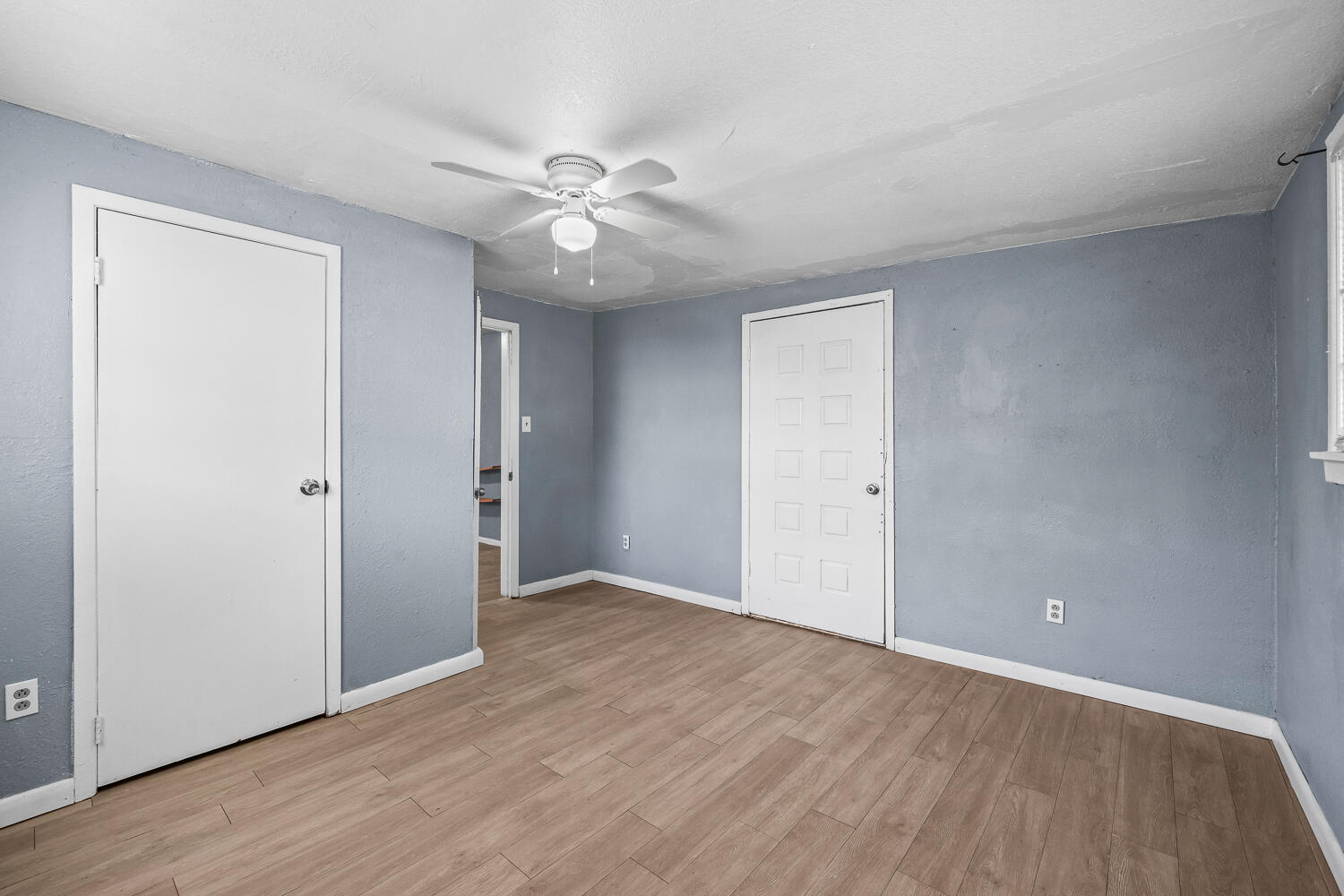 3409 East 17th Street Lubbock, TX 79403 - Photo 13 of 24 a view of an empty room with wooden floor
