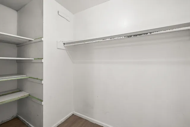 a view of an empty walk in closet