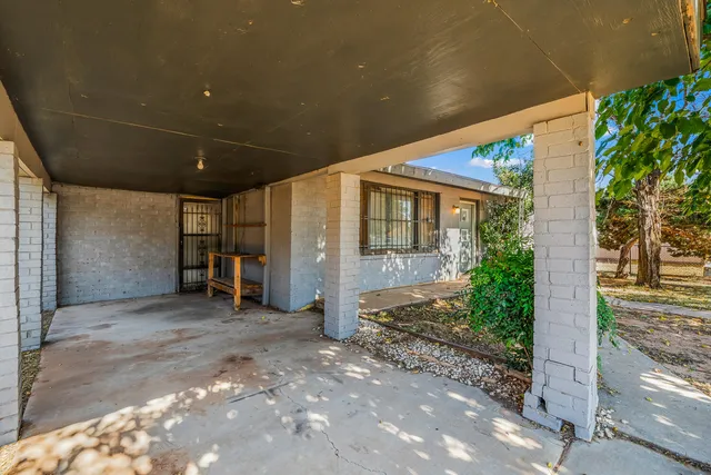 a view of a big room with an entryway and deck