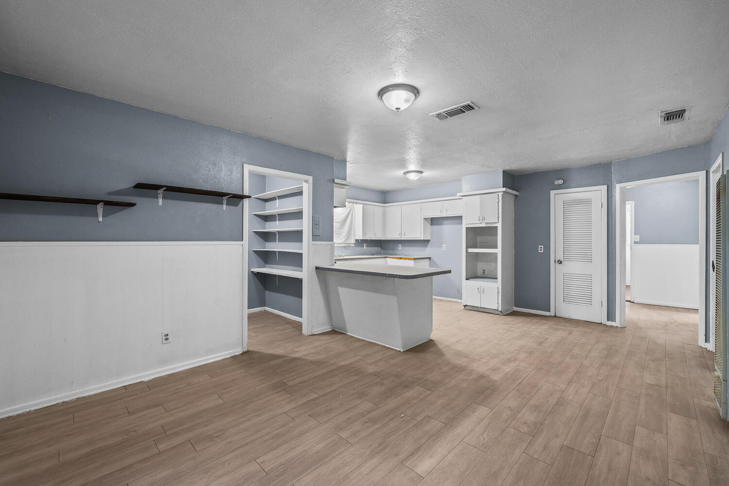3409 East 17th Street Lubbock, TX 79403 - Photo 6 of 24 a view of kitchen with wooden floor and electronic appliances