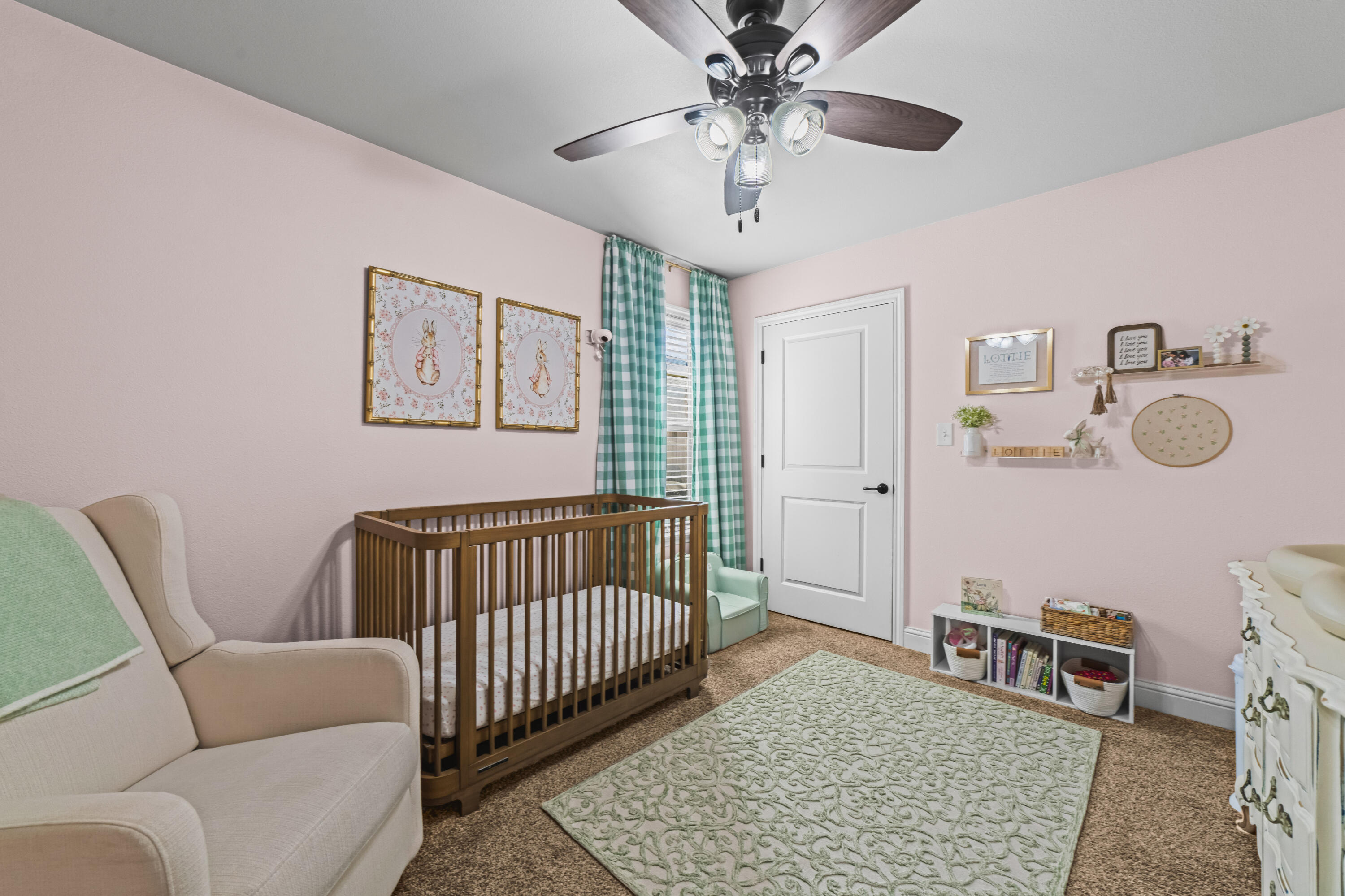 203 Cowboy Lane Wolfforth, TX 79382 - Photo 14 of 21 a bedroom with furniture and a chandelier