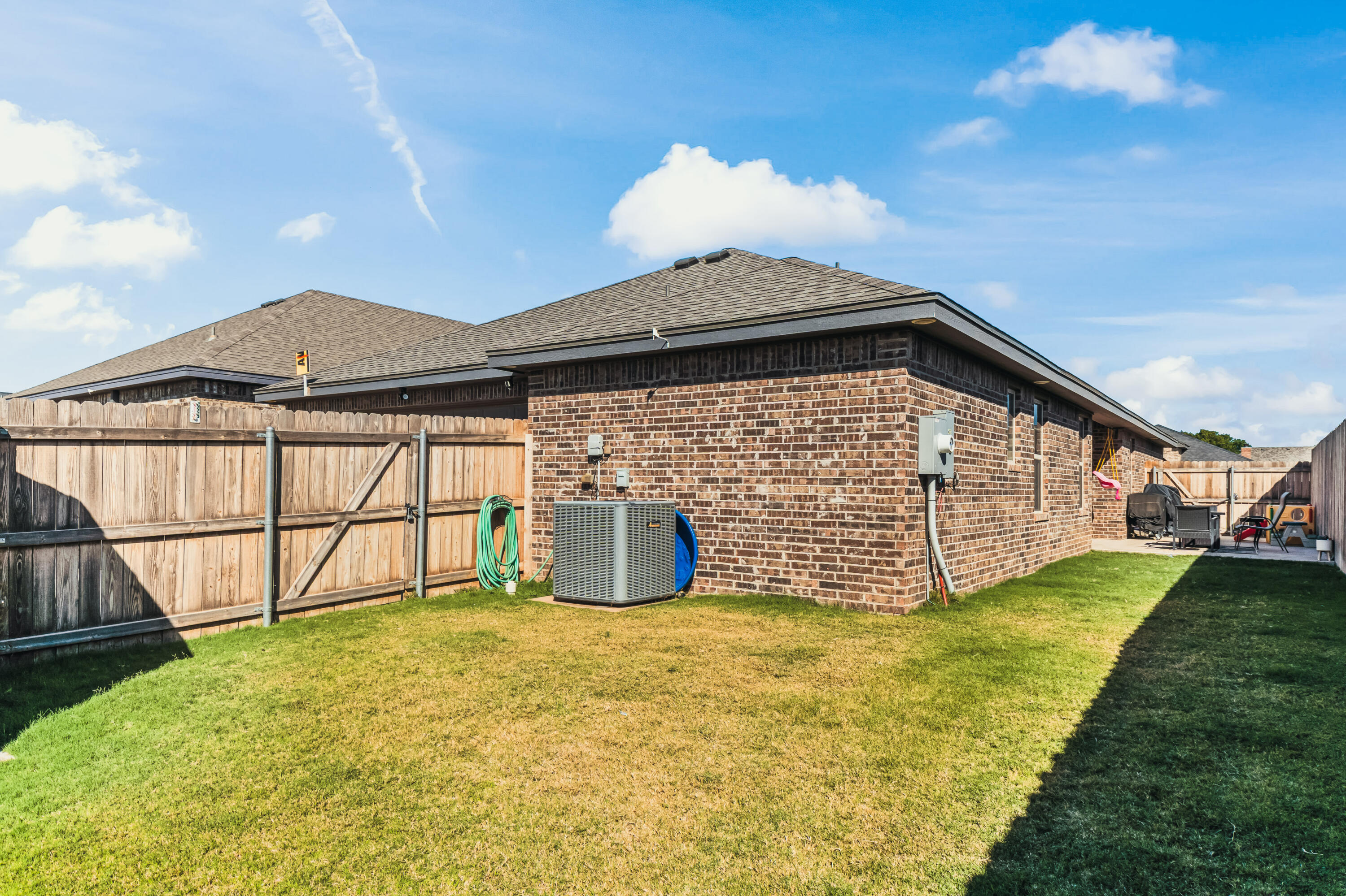 203 Cowboy Lane Wolfforth, TX 79382 - Photo 19 of 21 a view of a house with a yard