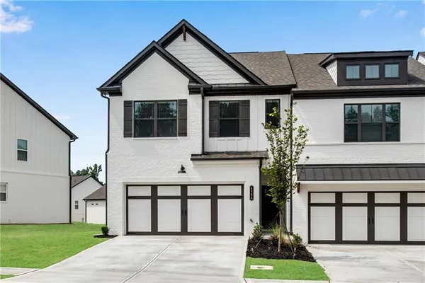 a front view of a house with a yard