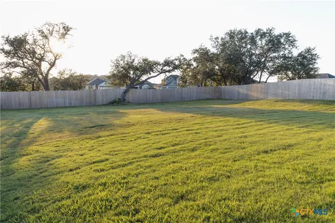 a view of a swimming pool and a yard