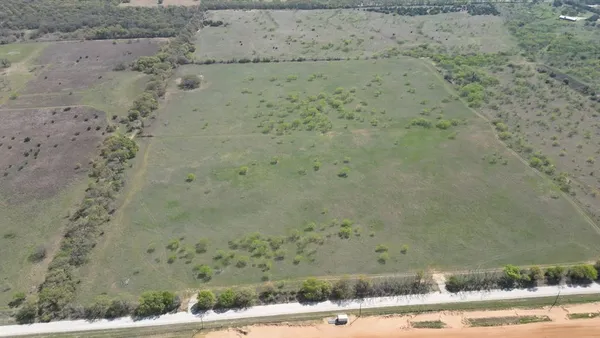 a view of a houses with a yard