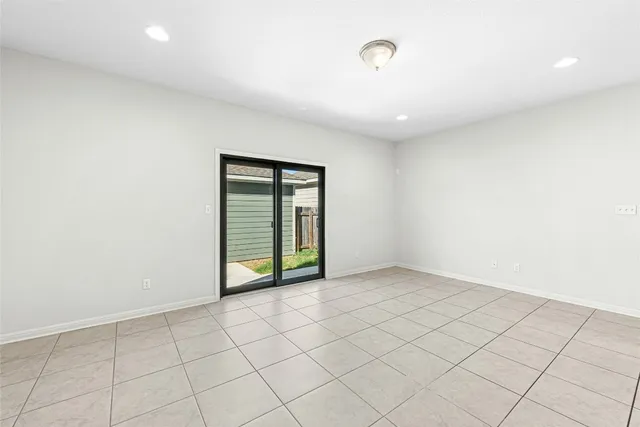 a kitchen with granite countertop a sink and a wooden floor