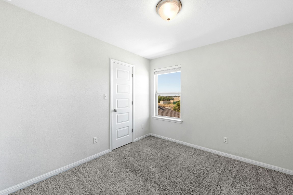 1709 Arendale Drive Leander, TX 78641 - Photo 24 of 36 an empty room with windows