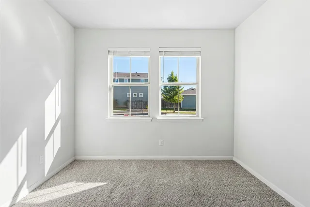 a bathroom with a bathtub shower sink vanity and toilet