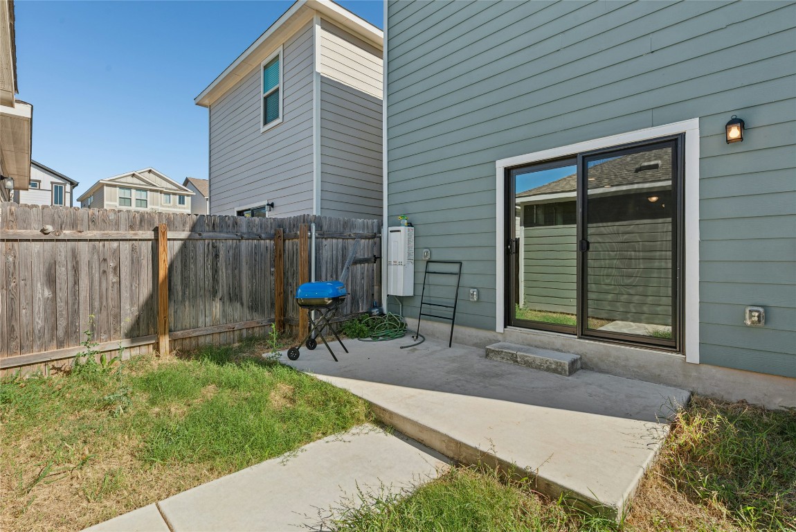 1709 Arendale Drive Leander, TX 78641 - Photo 32 of 36 a backyard of a house with table and chairs