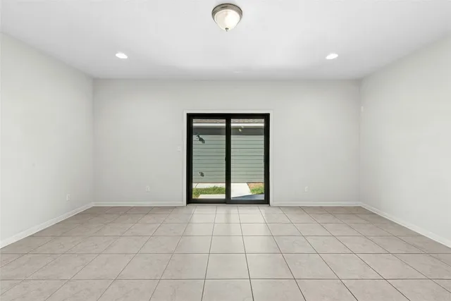 a view of a kitchen with a sink and dishwasher with wooden floor