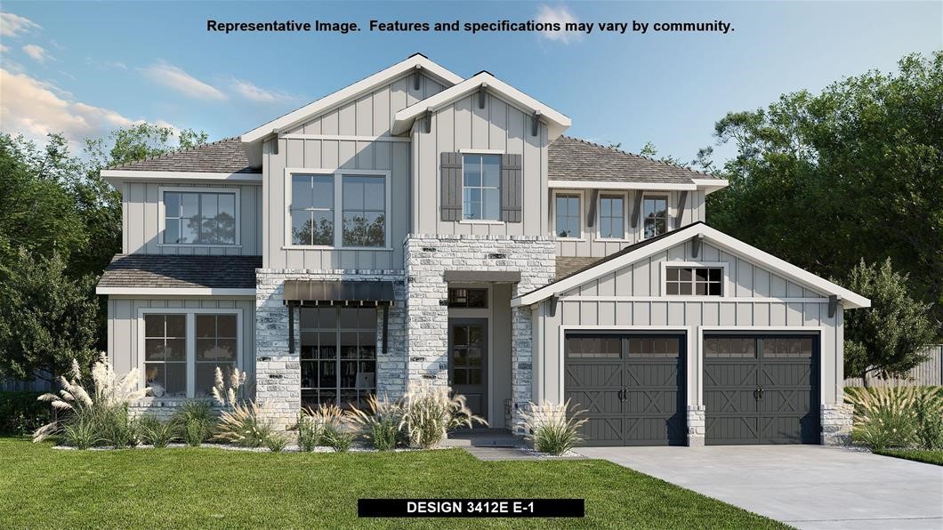 a front view of a house with a yard and potted plants
