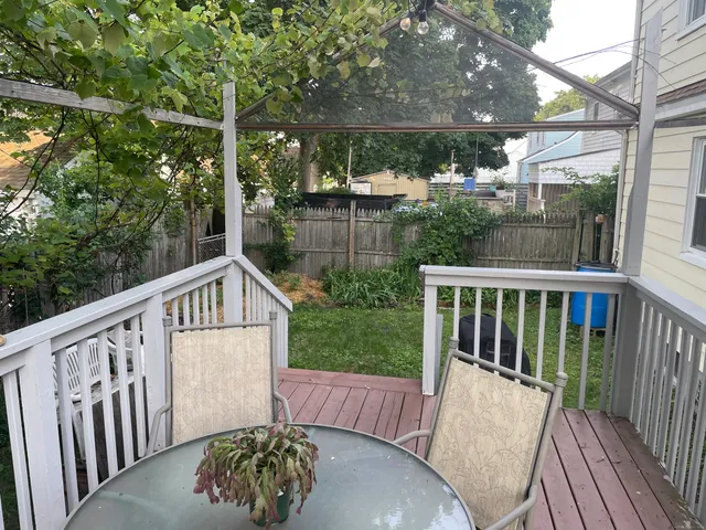a view of balcony with furniture