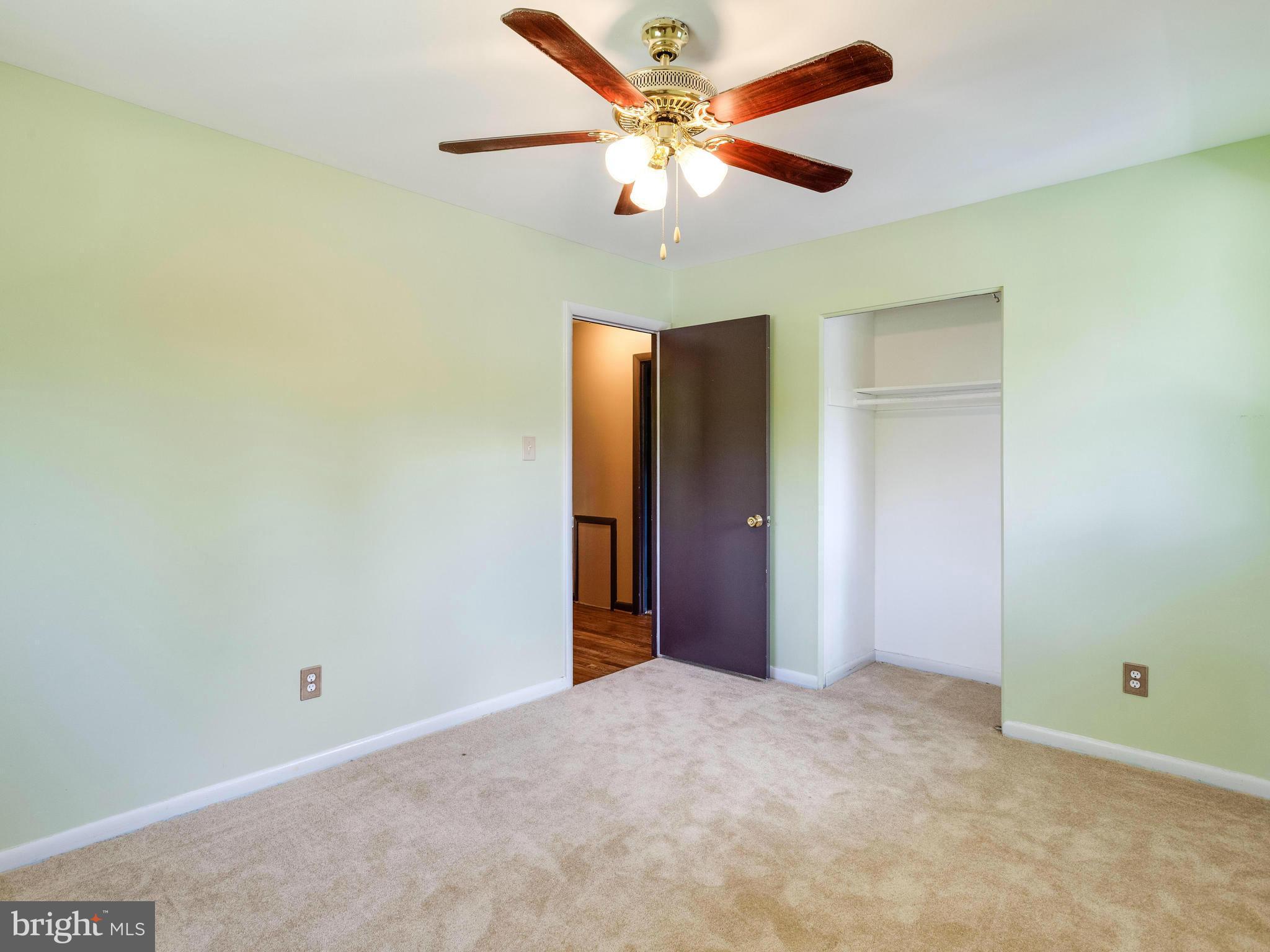 3908 Elby Street Silver Spring, MD 20906 - Photo 17 of 24 an empty room with a fan and a fan
