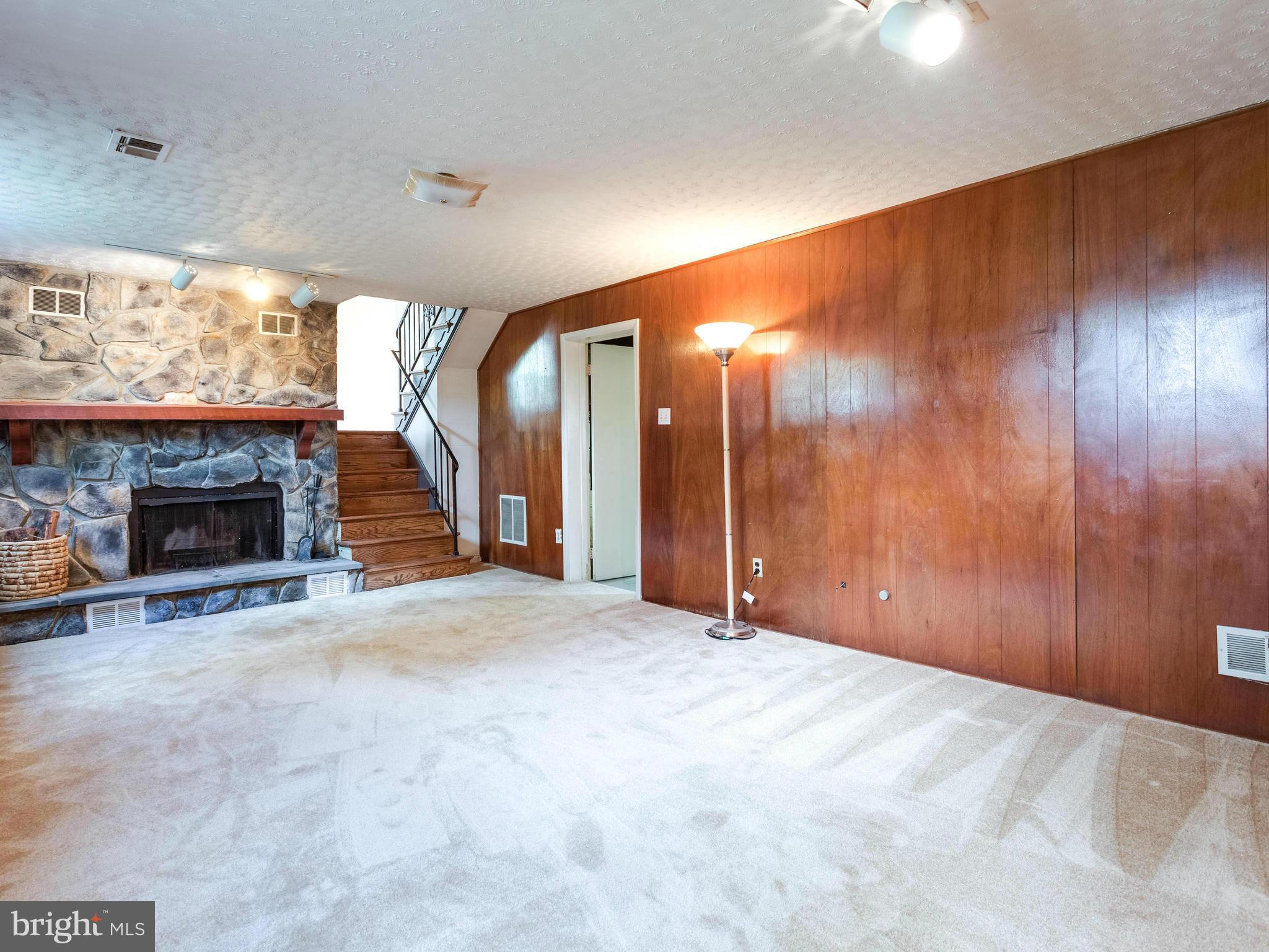 3908 Elby Street Silver Spring, MD 20906 - Photo 20 of 24 a view of an empty room with a fireplace