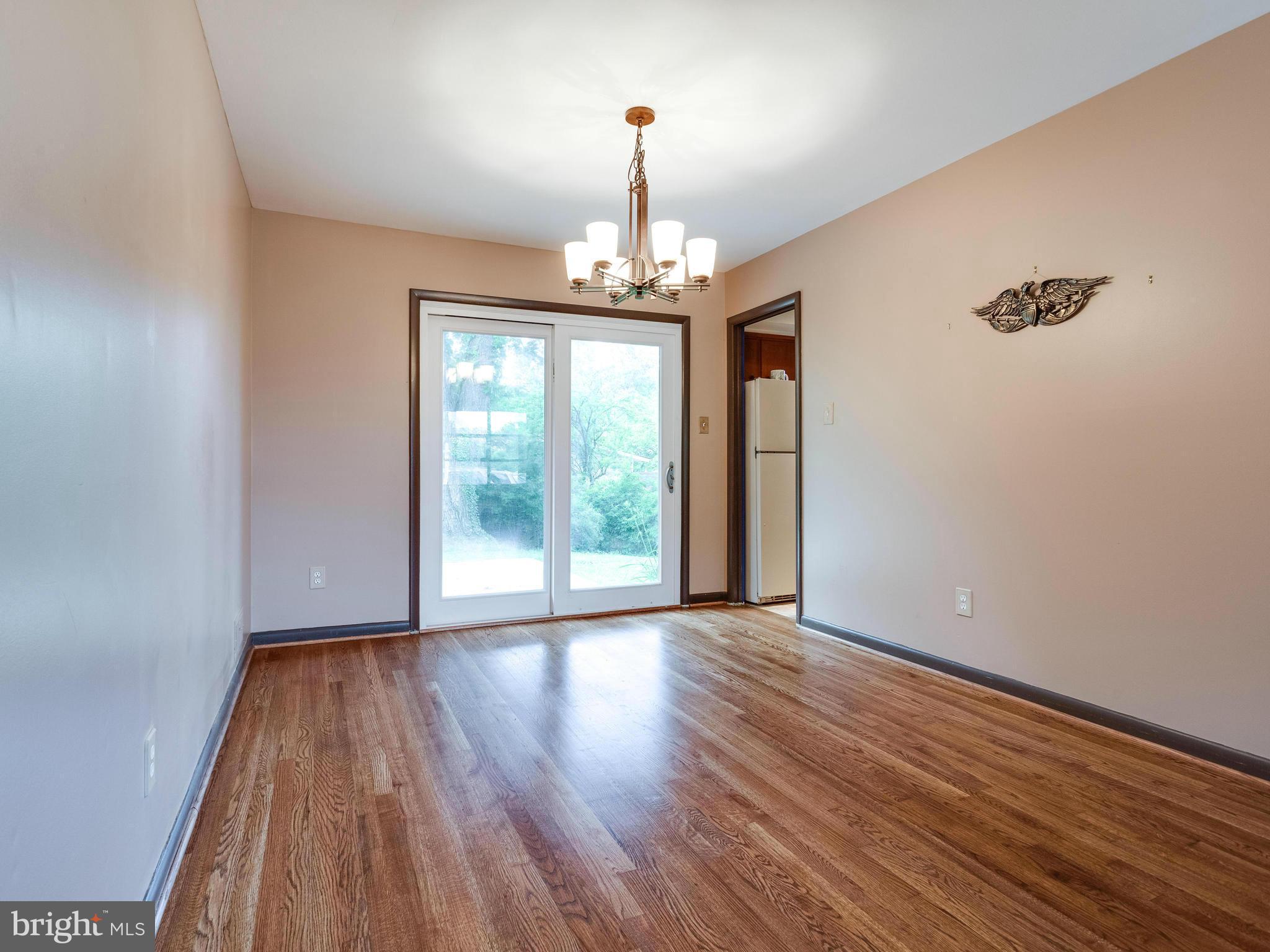 3908 Elby Street Silver Spring, MD 20906 - Photo 6 of 24 wooden floor in an empty room with a window