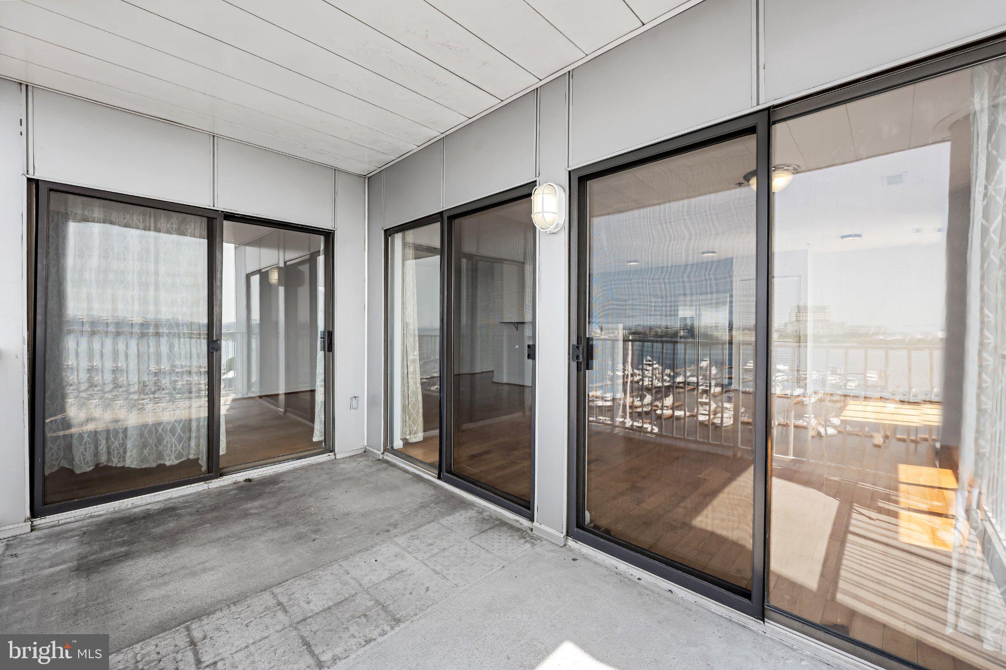 2702 Lighthouse Point East, Unit 738 Baltimore, MD 21224 - Photo 17 of 33 Scenic balcony with expansive views.