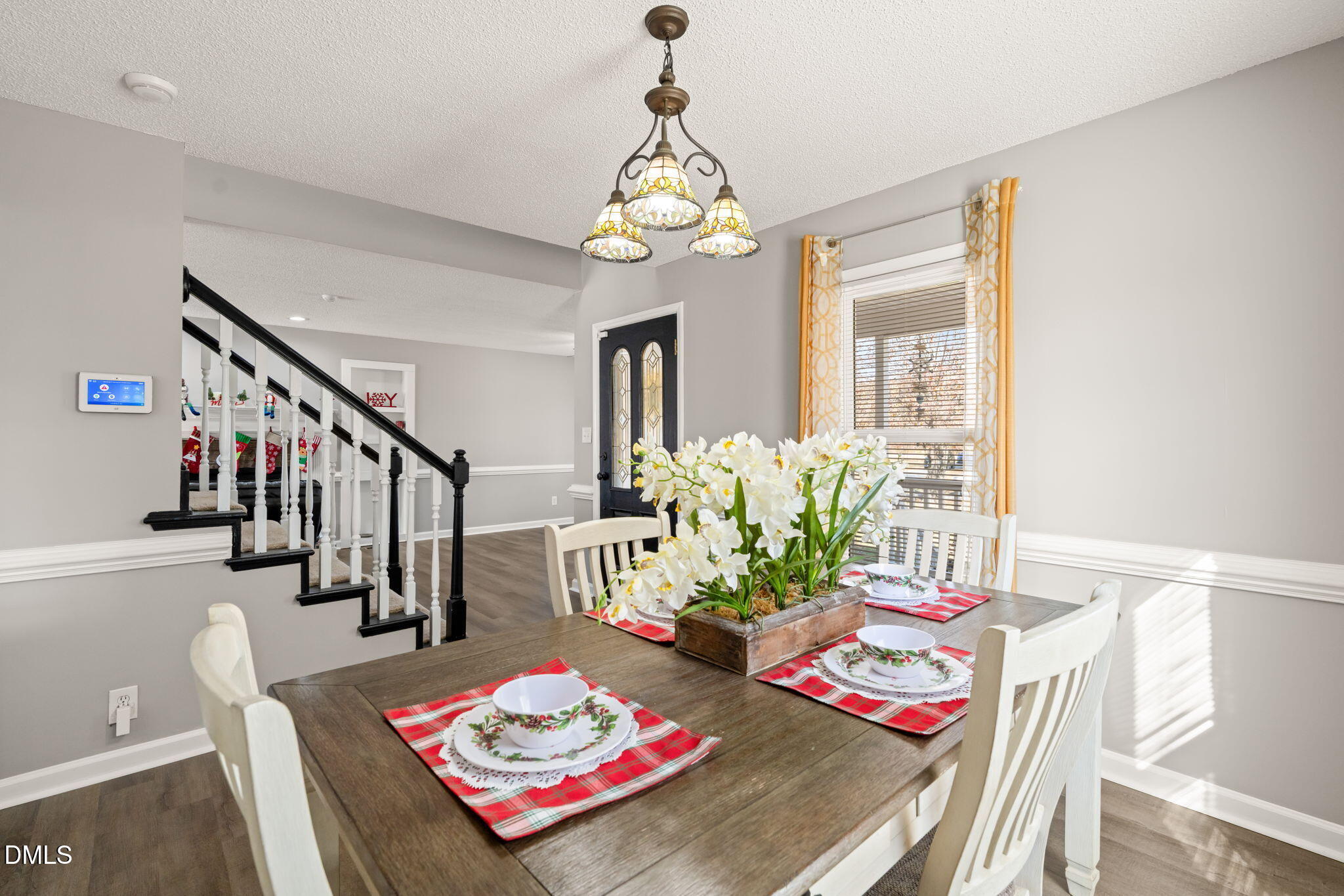 3649 Cleveland Road Smithfield, NC 27577 - Photo 14 of 37 a living room with furniture dining table and a chandelier