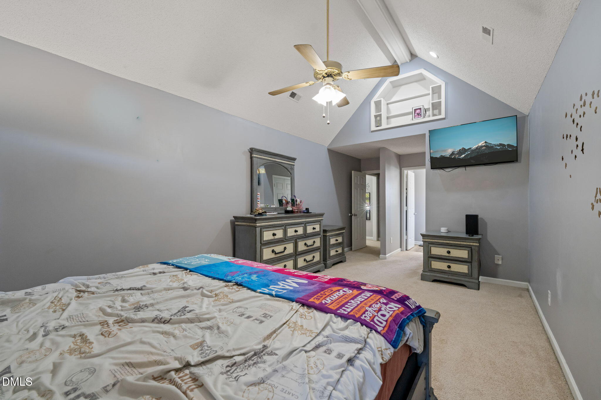 3649 Cleveland Road Smithfield, NC 27577 - Photo 19 of 37 a bedroom with a bed and a chandelier